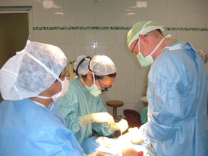 Dr's Karen Myung, David Mann, and our Honduras partner in surgery.