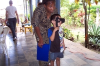 Hadja helps with child's eye exam.
